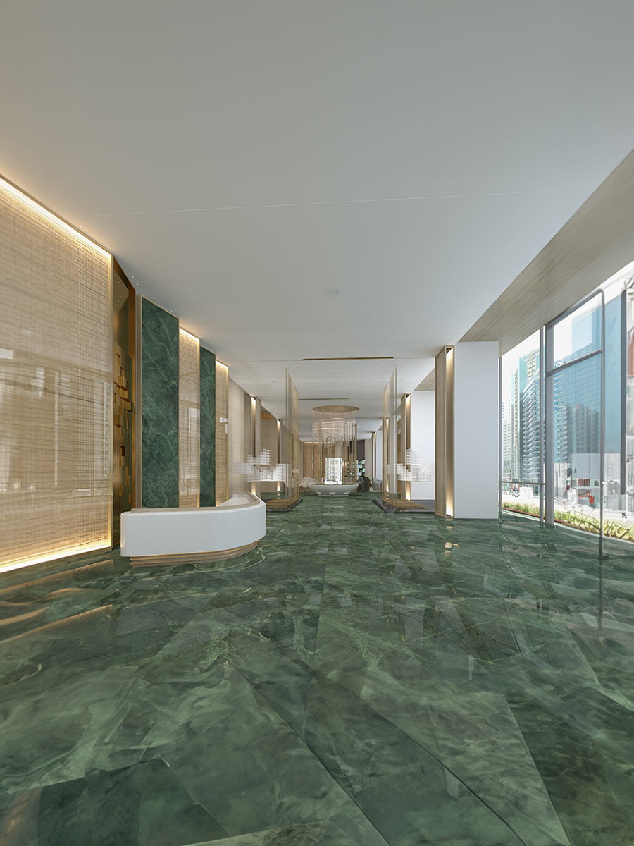 Luxury lobby interior featuring green porcelain slab floor and large glass windows