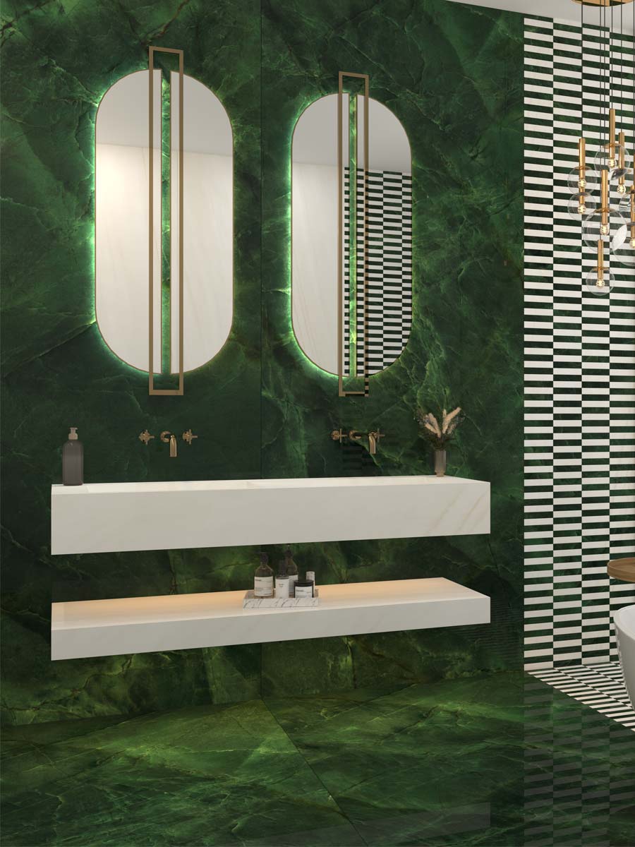 A bathroom with a ceramic wash basin, designed with a green porcelain slab