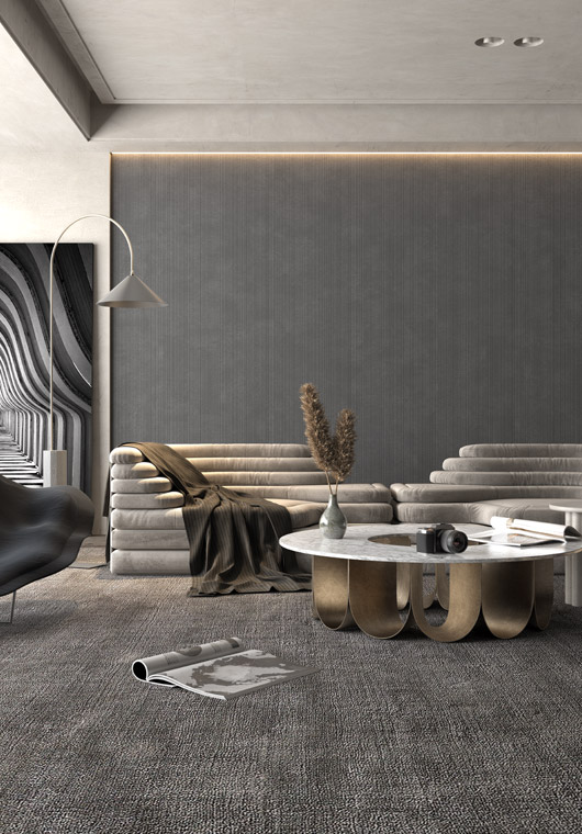 Modern living room with gray ceramic wall tiles and textured flooring, featuring minimalist furniture and a marble coffee table.