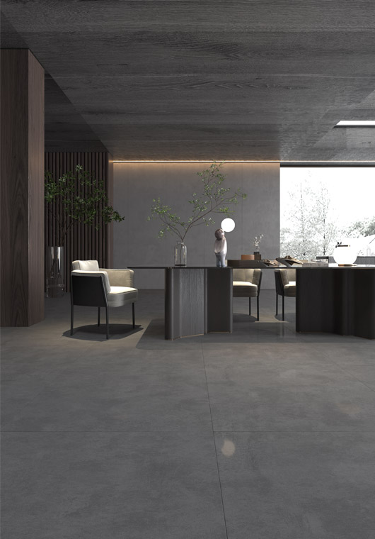 Contemporary office space with large-format ceramic floor tiles and a sleek gray accent wall, complemented by modern decor.